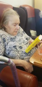Grandma with a new book
